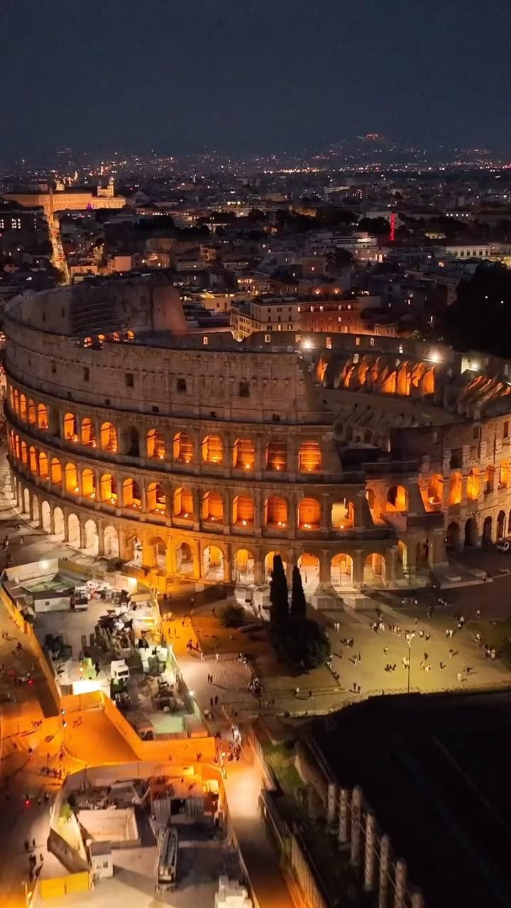 The Colosseum illuminated at night in Rome